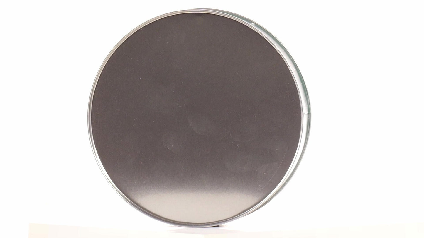 Round green metal tin with Santa Claus design