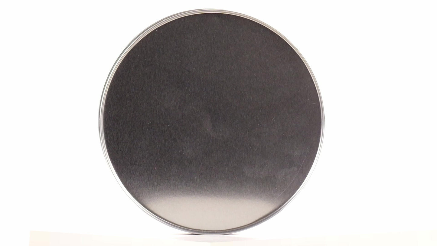 Round green metal tin with Santa Claus design