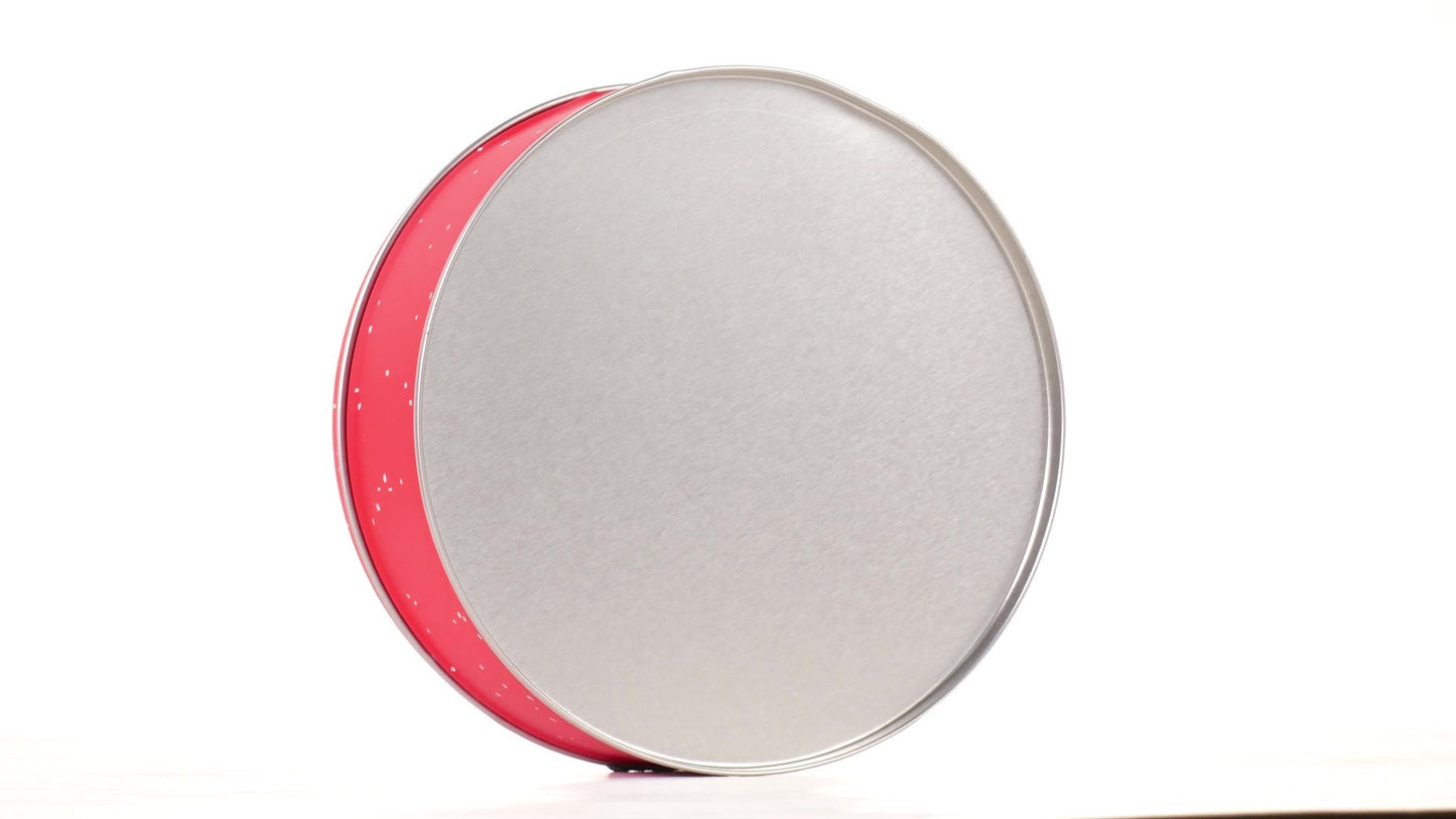 Round red metal tin with Santa Claus design