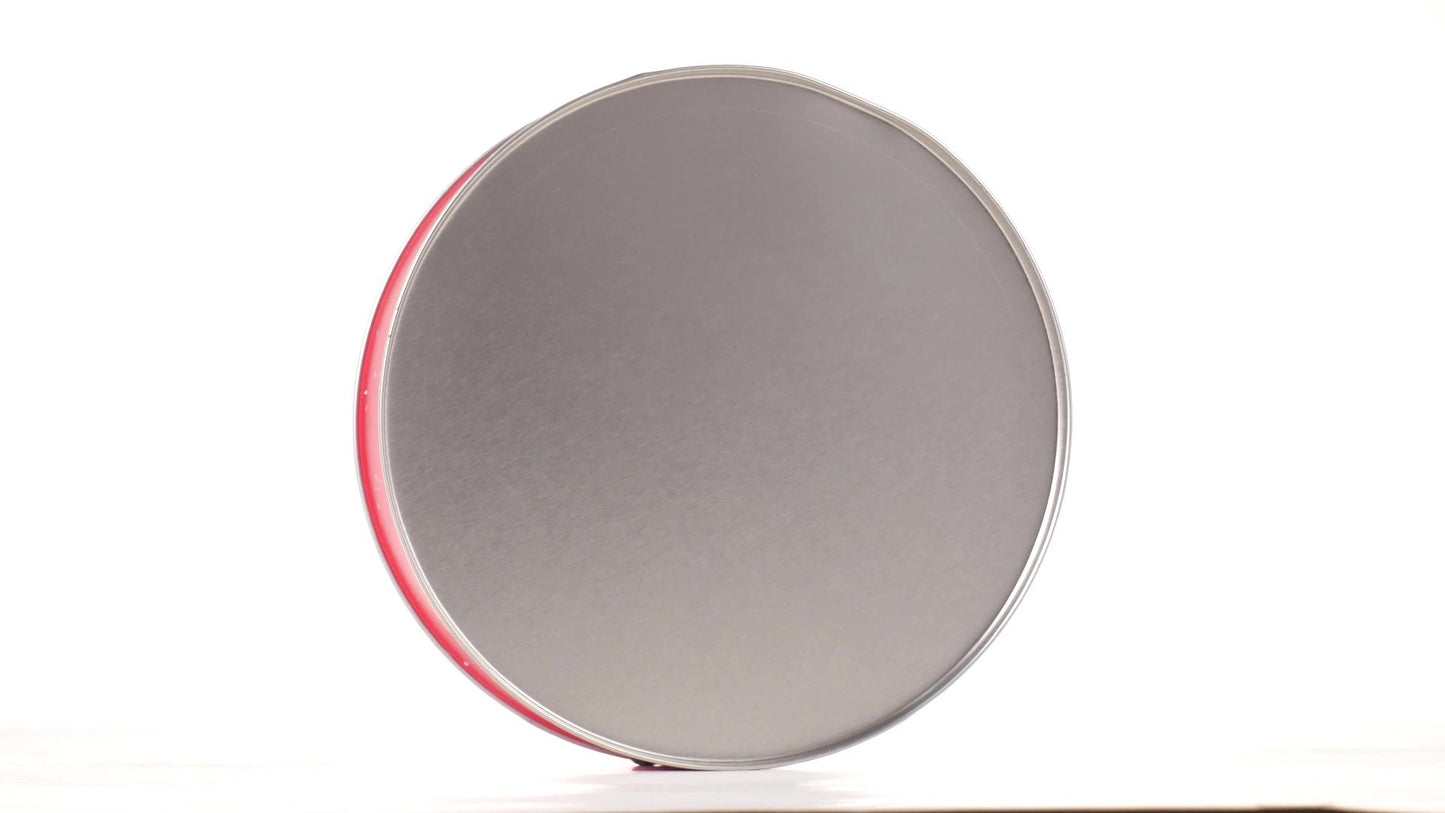 Round red metal tin with Santa Claus design