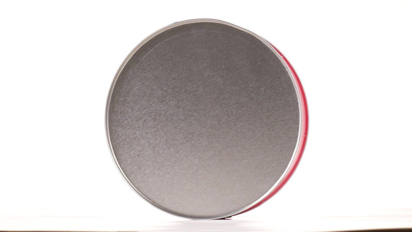 Round red metal tin with Santa Claus design