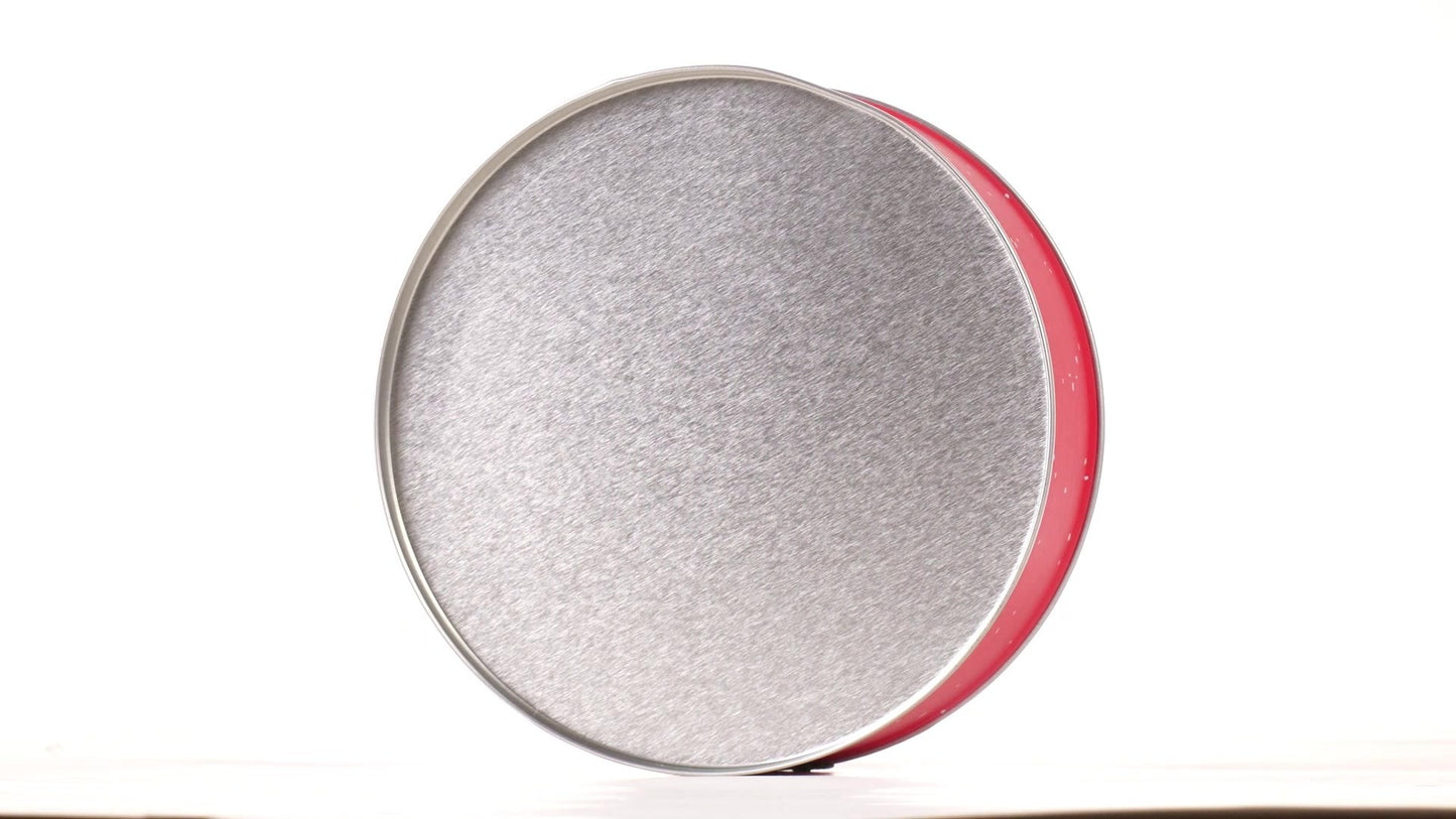 Round red metal tin with Santa Claus design