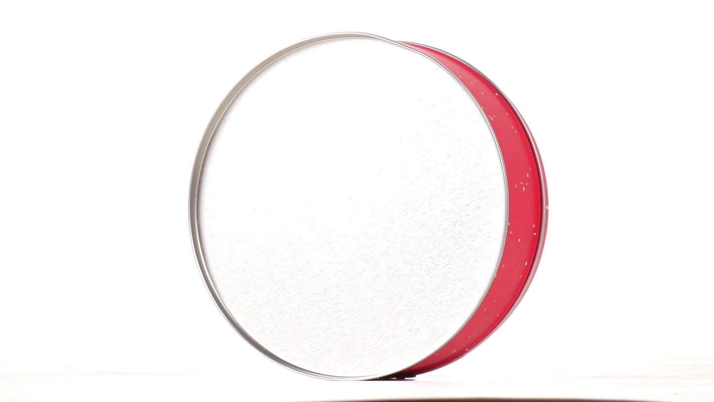 Round red metal tin with Santa Claus design