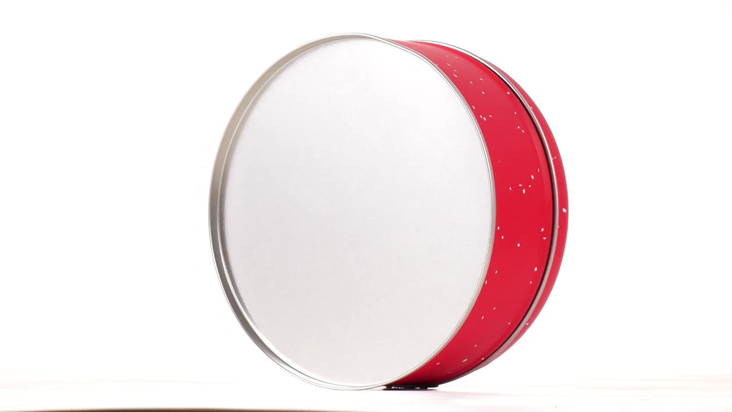 Round red metal tin with Santa Claus design