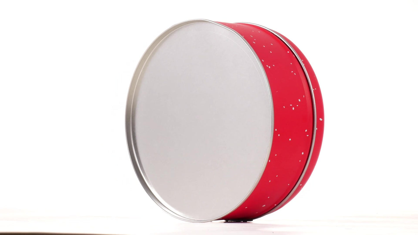 Round red metal tin with Santa Claus design