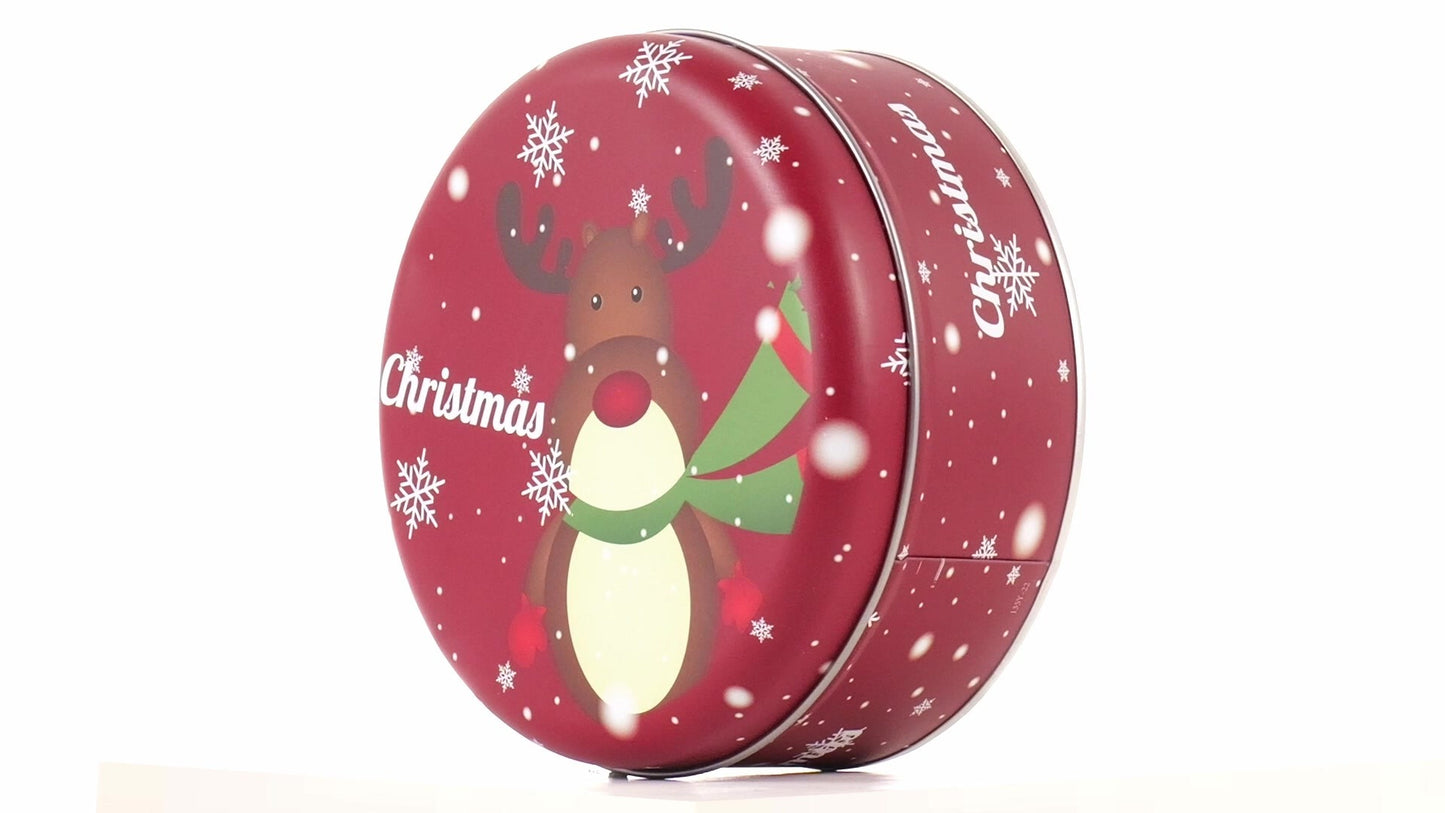 Round red metal tin with Christmas reindeer pattern