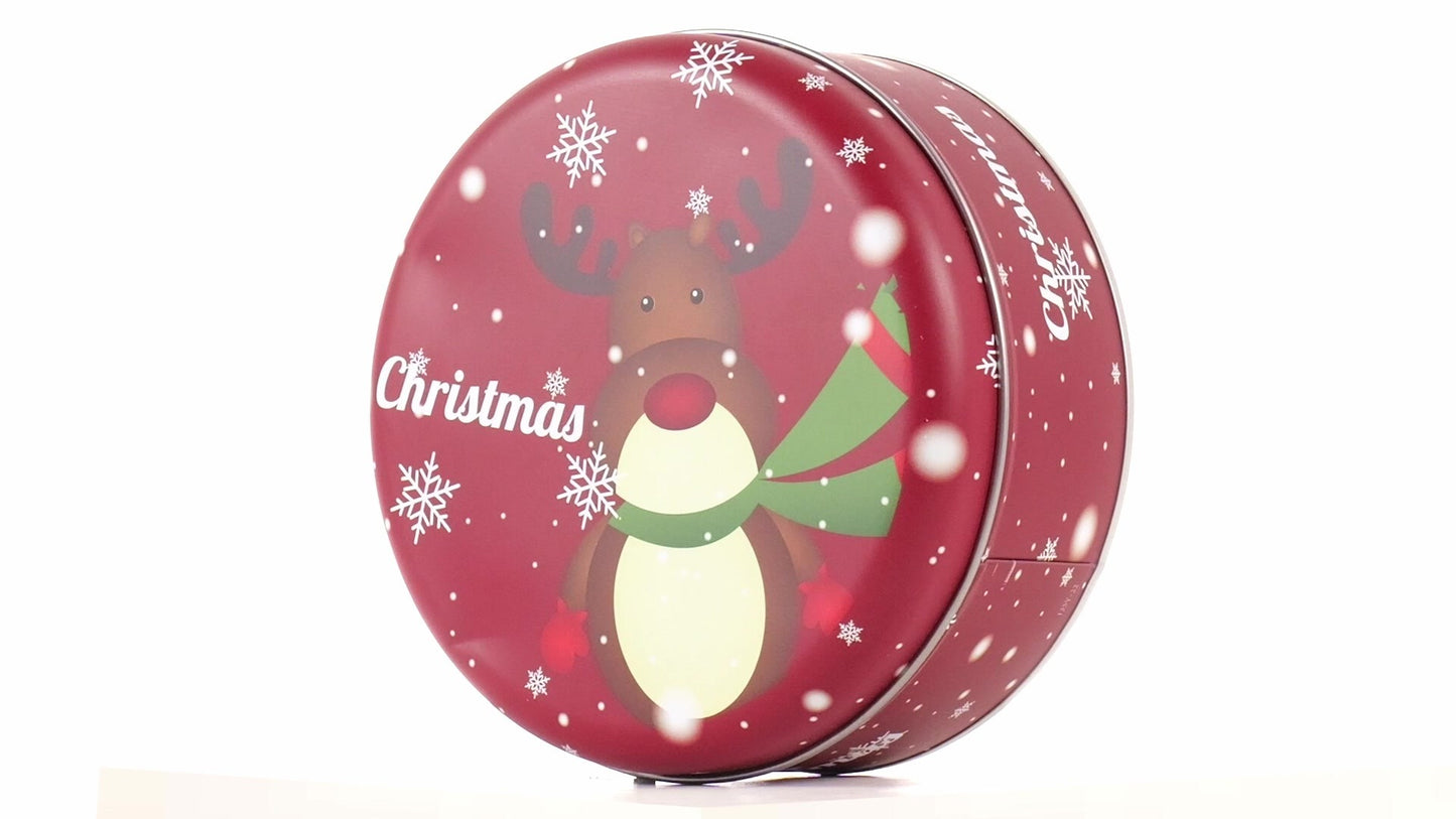 Round red metal tin with Christmas reindeer pattern