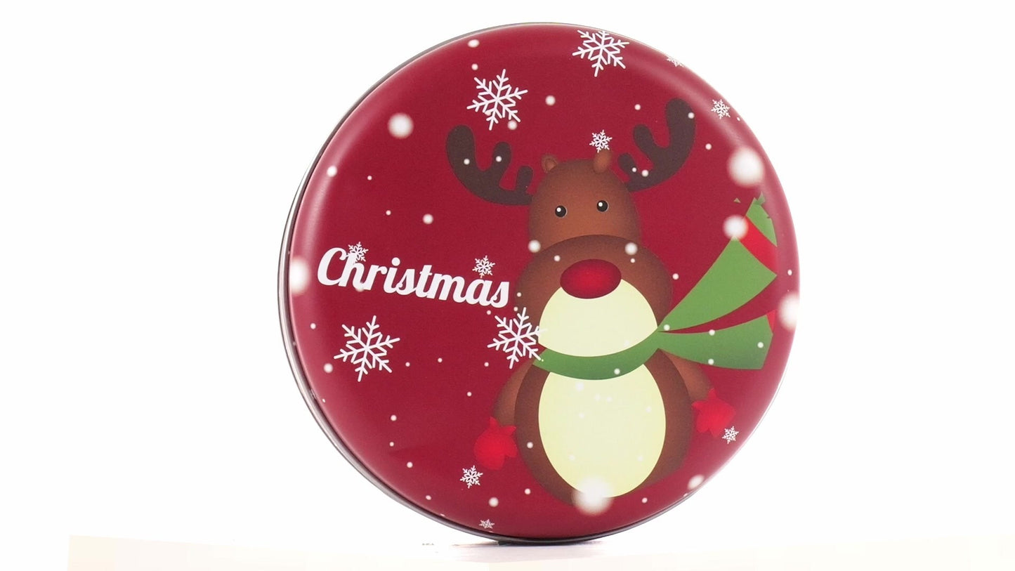 Round red metal tin with Christmas reindeer pattern