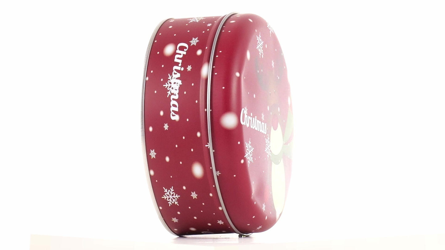 Round red metal tin with Christmas reindeer pattern
