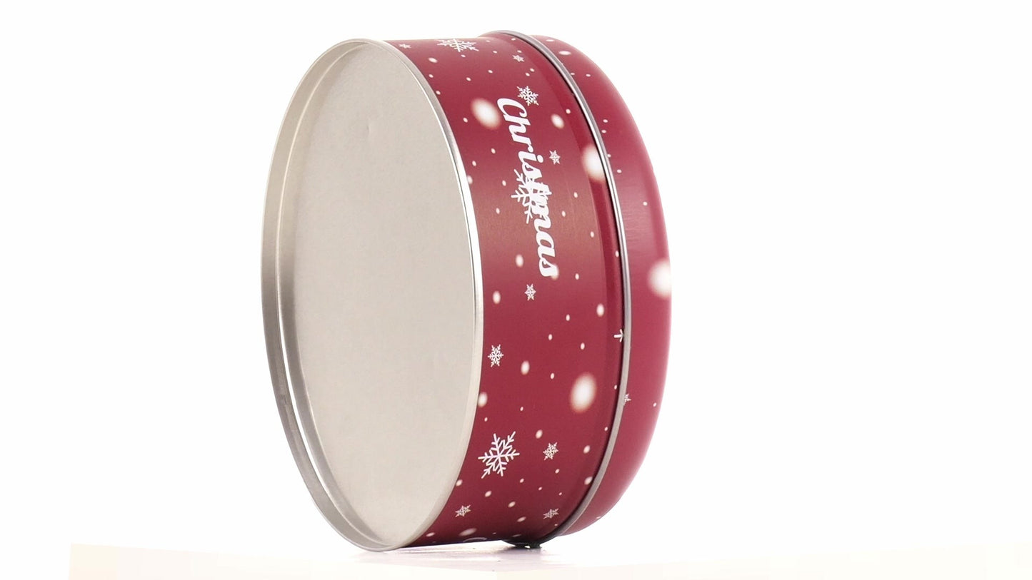 Round red metal tin with Christmas reindeer pattern