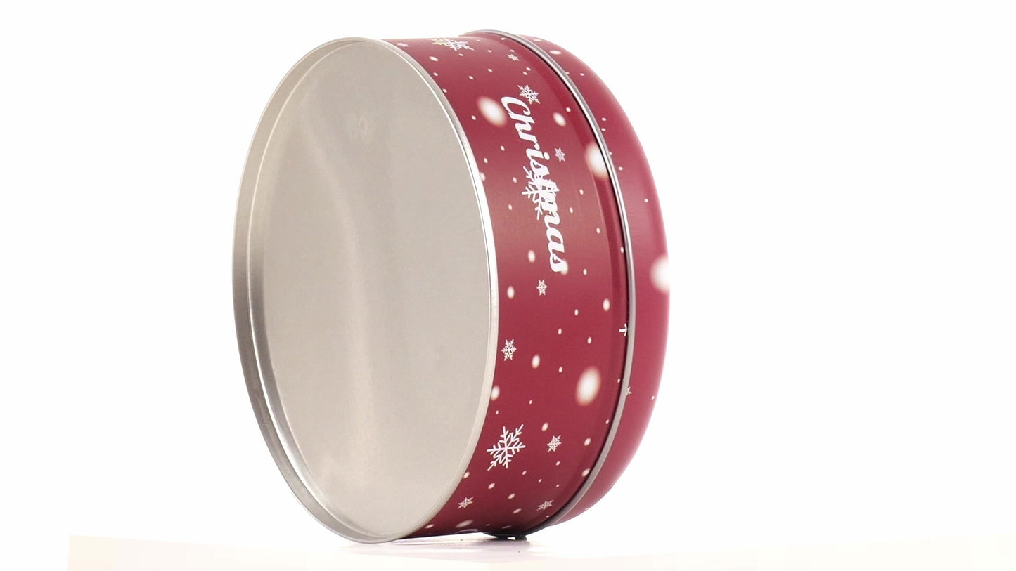 Round red metal tin with Christmas reindeer pattern