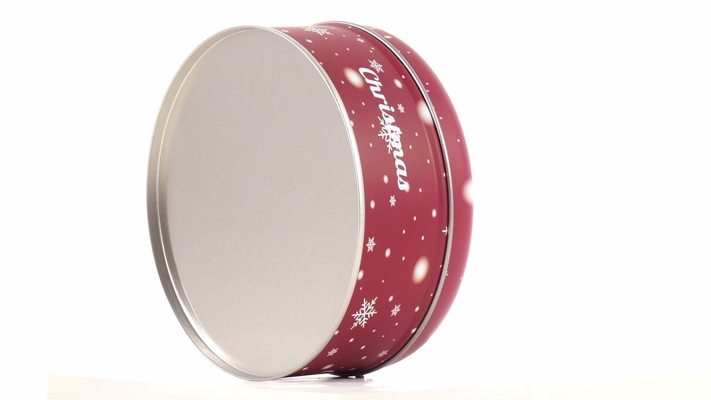 Round red metal tin with Christmas reindeer pattern