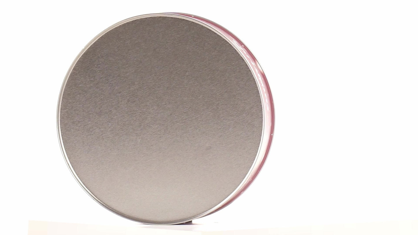Round red metal tin with Christmas reindeer pattern