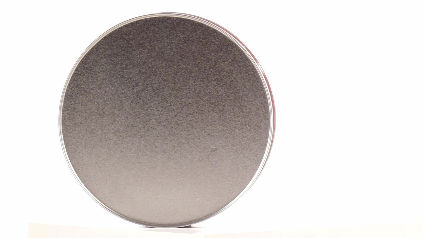 Round red metal tin with Christmas reindeer pattern