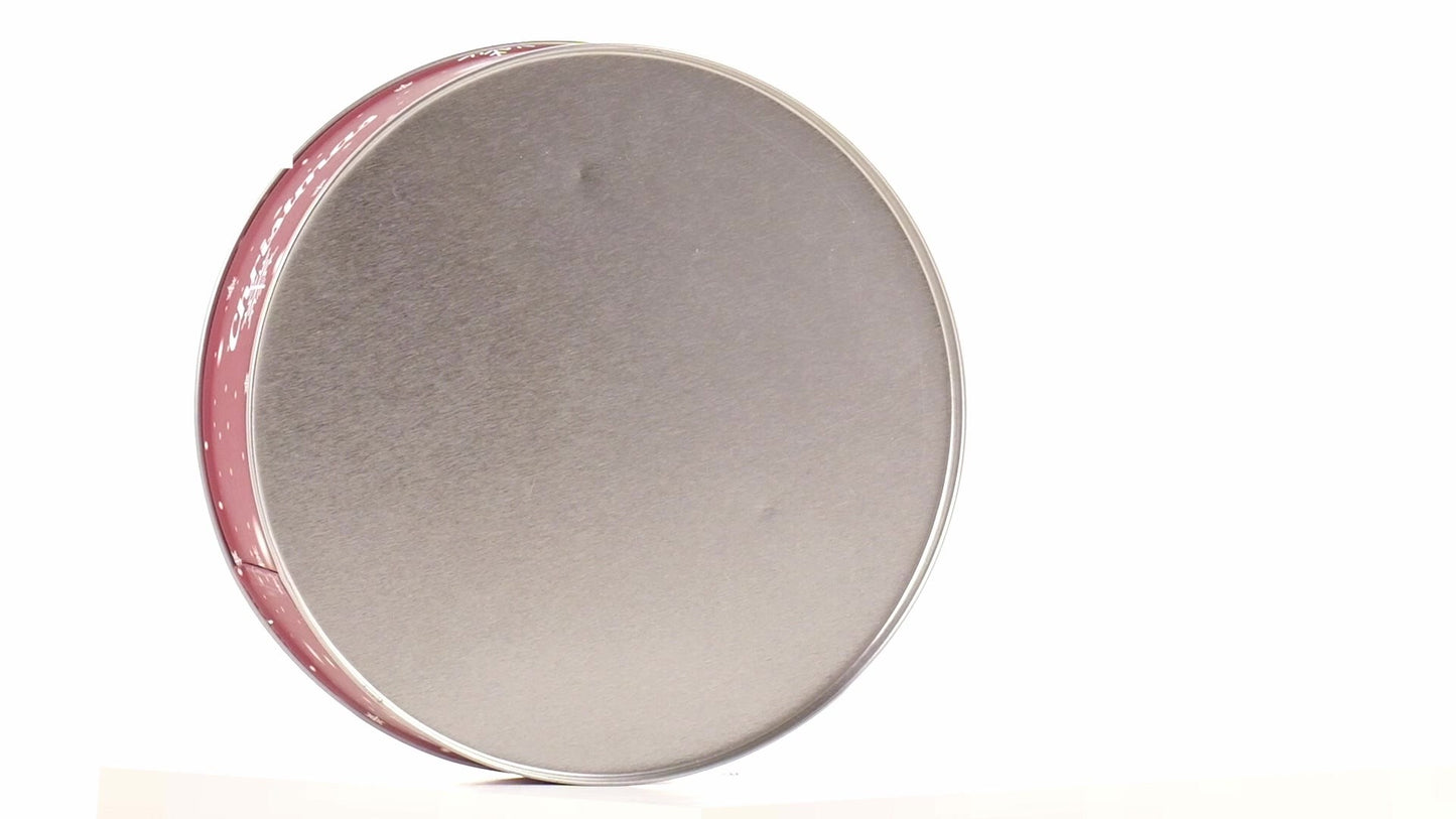 Round red metal tin with Christmas reindeer pattern