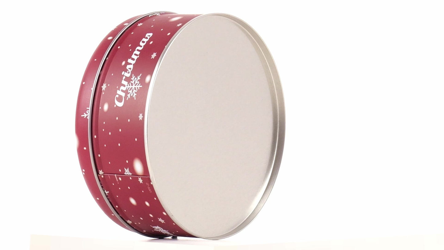 Round red metal tin with Christmas reindeer pattern